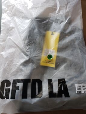 Drake Grey Garment with Yellow Hang Tag